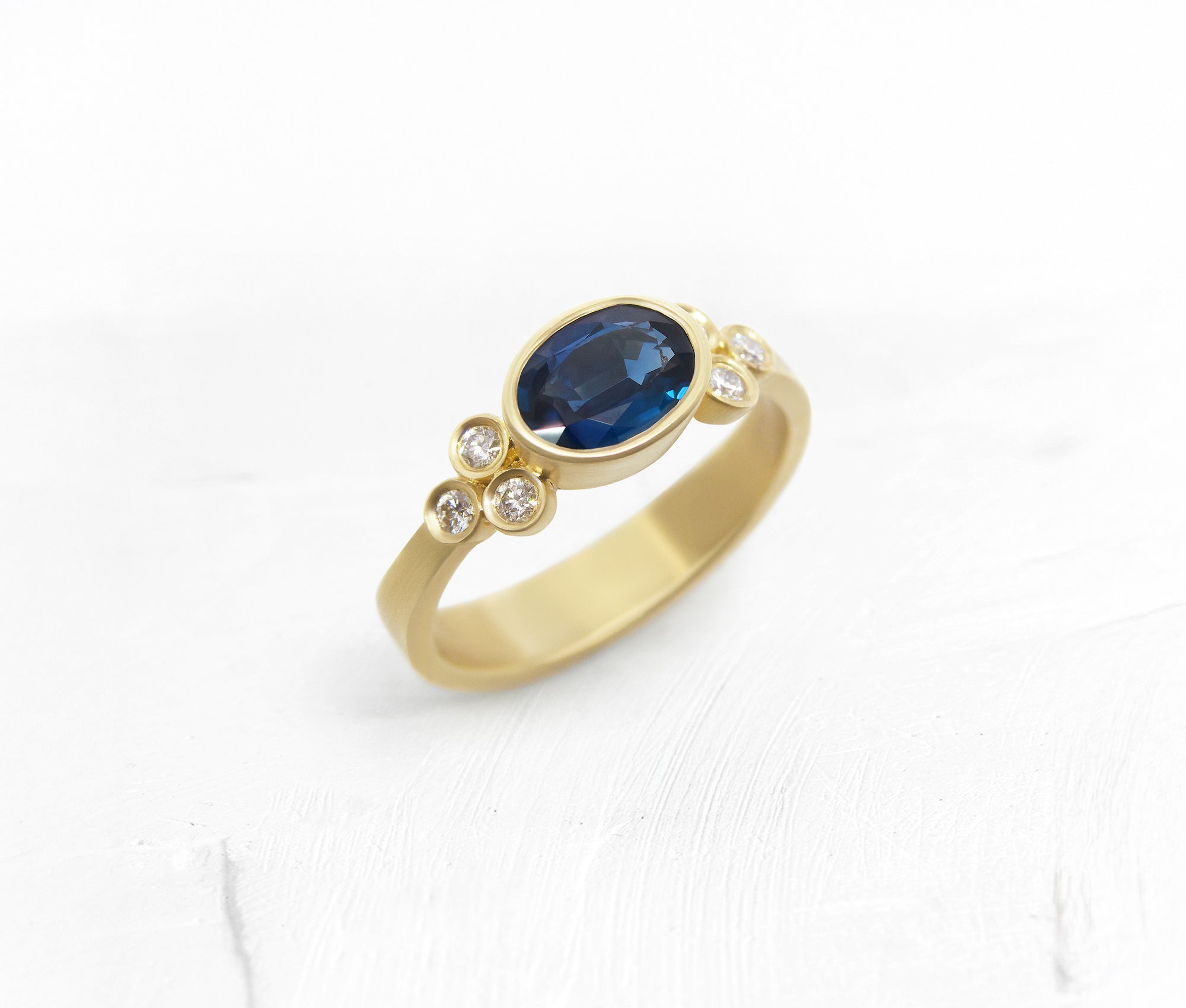 Oval Sapphire Gold Ring with Diamond Accents