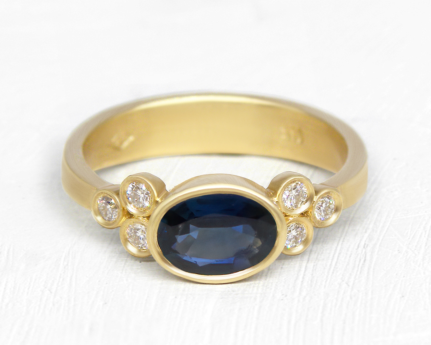 Oval Sapphire Gold Ring with Diamond Accents