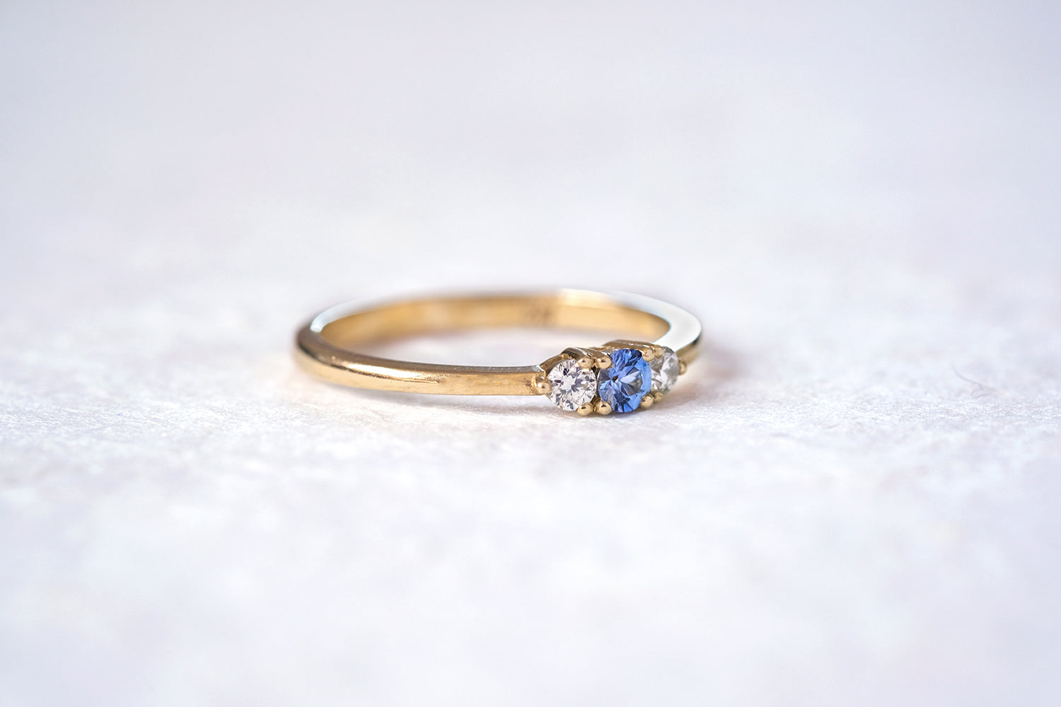 Engagement Gold Ring Set With A Sapphire And Two Diamonds