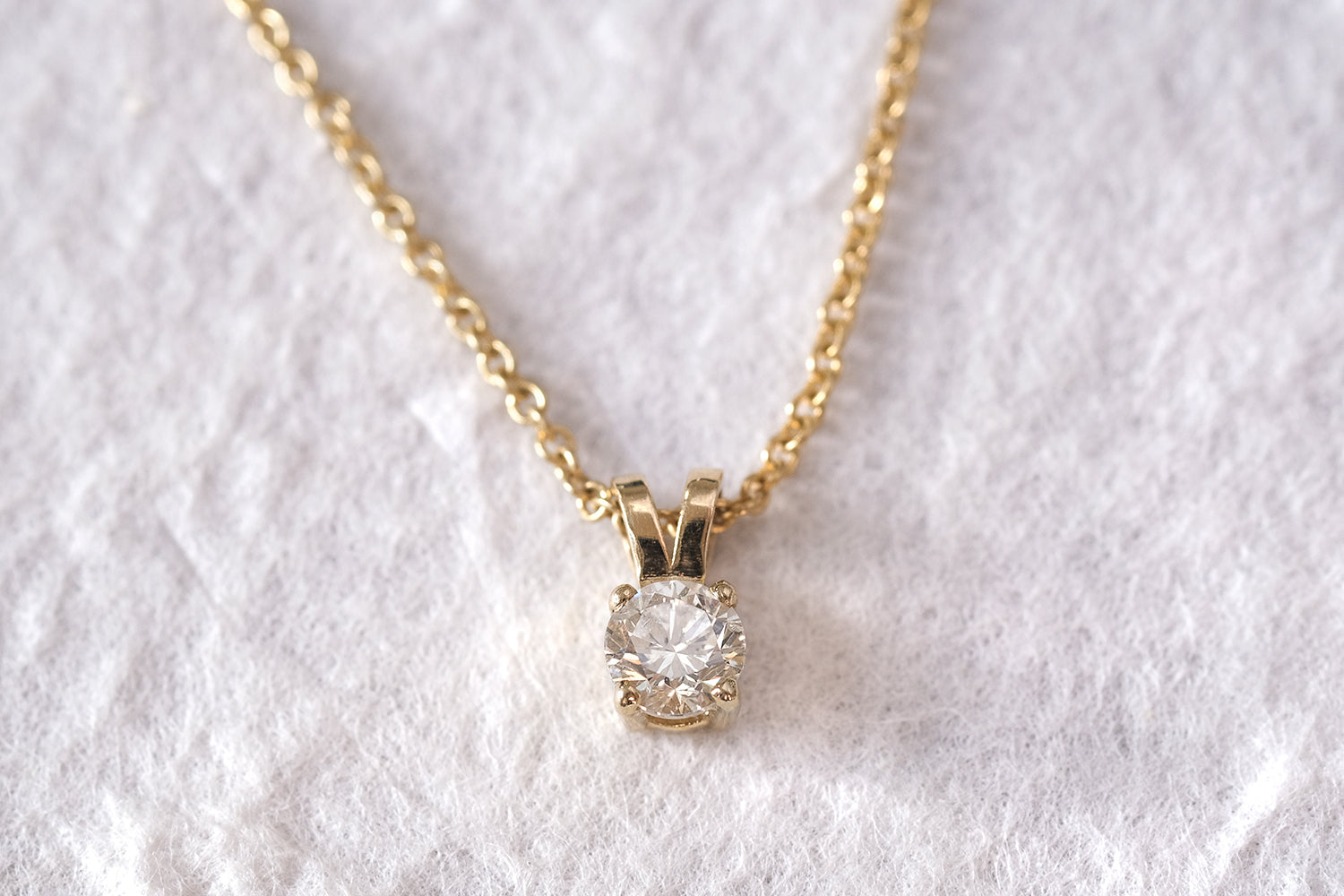 Gold Necklace With A Diamond Pendant