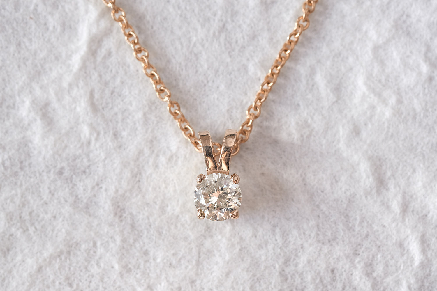 Gold Necklace With A Diamond Pendant