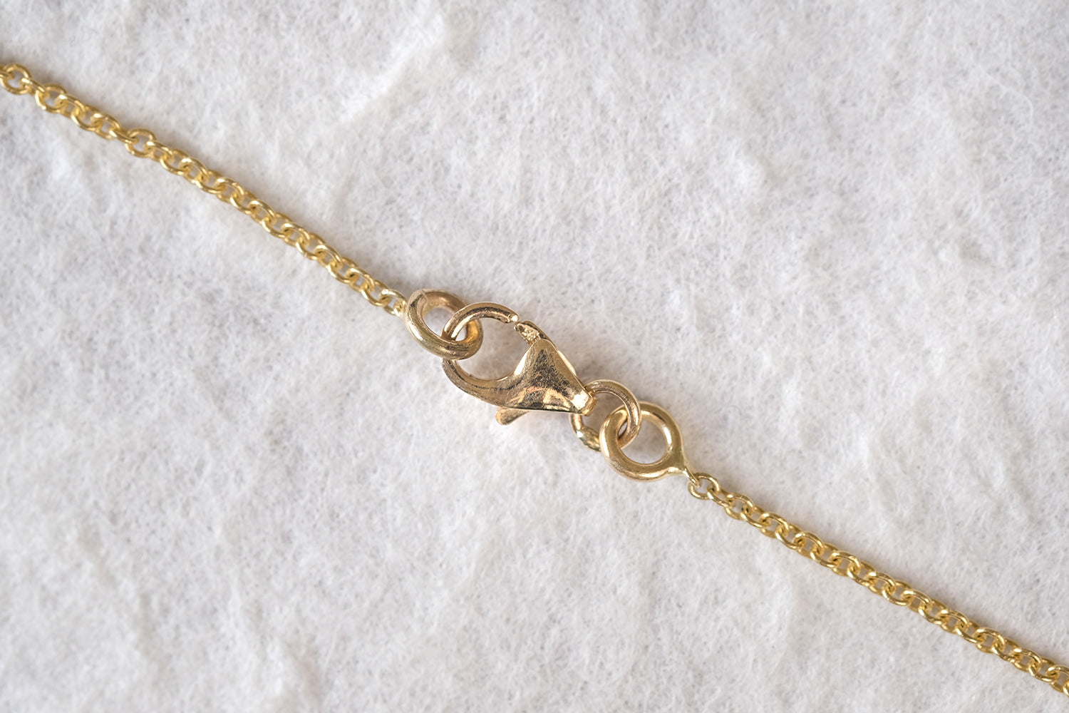 Gold Necklace With A Diamond Pendant