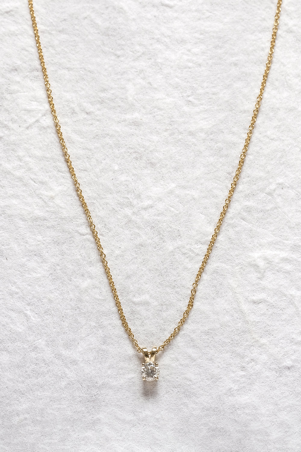 Gold Necklace With A Diamond Pendant