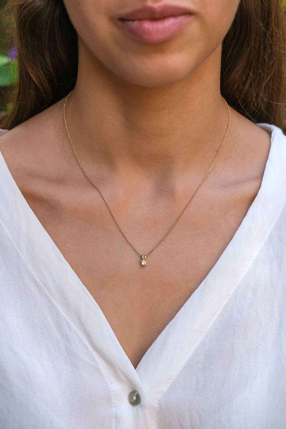 Gold Necklace With A Diamond Pendant